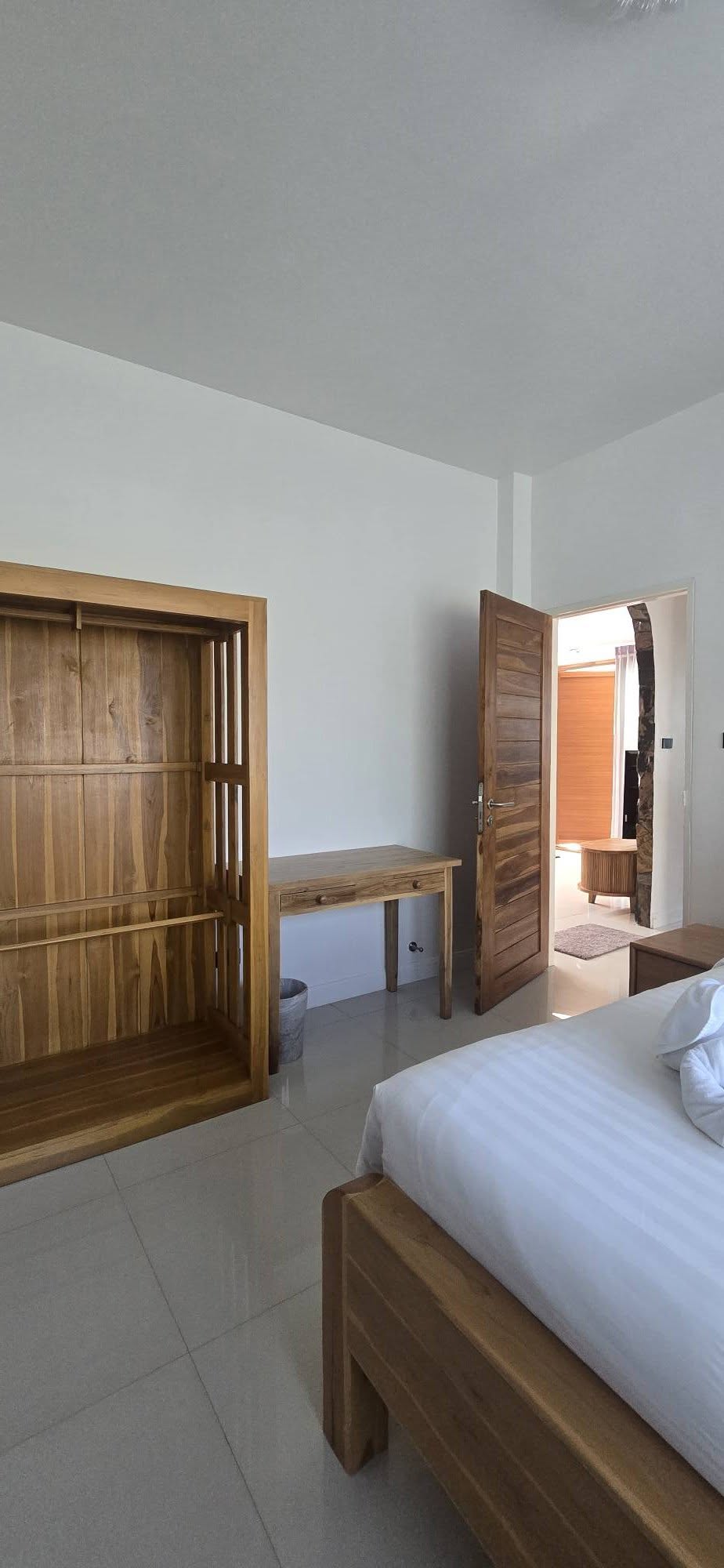 Bedroom wardrobe and desk in light wood with open hanging space